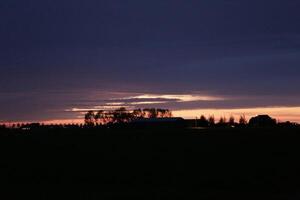 sunset in the netherlands, clouds, colors photo