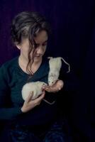 an albino standard rat and albino standard rat cuddles with theie owner photo