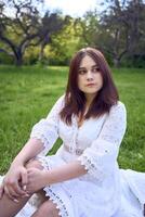 a portrait of a teenage girl in a pastel dress on a picnic photo