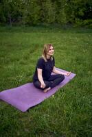 a woman and girl do yoga and meditate in nature photo