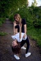 the coach teaches the girl to make a bridge photo