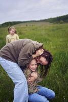 mother plays catch up with her daughters photo