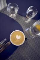 cups of coffee, latte and cappuccino on a table in a cafe photo