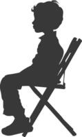 Silhouette little boy sitting in the chair black color only vector