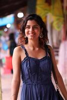 Lady Wearing In Blue Summer Dress Posing In Market photo