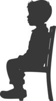 Silhouette little boy sitting in the chair black color only vector