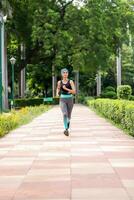 Image of Woman Jogging In Park photo