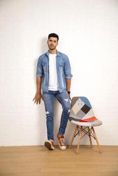 Portrait Of Nice Guy Is Posing In Front Of Camera photo