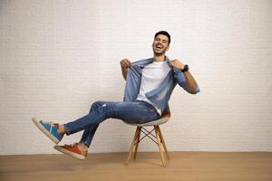 Modern Cute Man Is Posing Over White Background photo