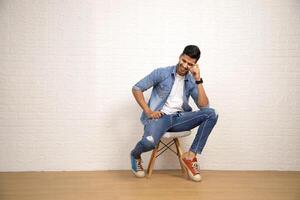 Photoshoot Of Hot Sexy Man While Sitting On Chair photo