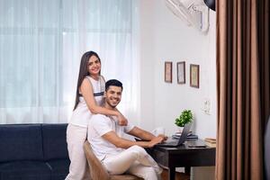 Image Of Sweet Couple In White Outfit Posing In Front Of Camera photo