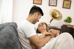 Picture Of Sweet Couple Holding Hands And Looking At Each Other photo