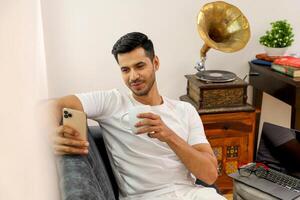 Man Using Phone For Watching photo