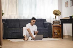 Young Man In White T Shirt Laughing photo