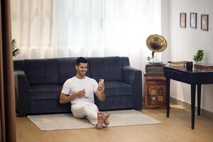 Smiling Man Is Holding A Cup Of Coffee photo