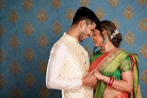 Image Of A Hot Indian Couple In Traditional Attire Holding Hands photo