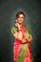 Beautiful Model In Saree Posing For Camera photo