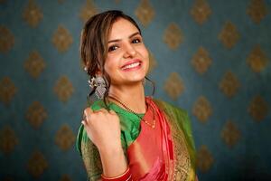 Picture Of A Hot Lady In Saree Smiling And Posing In Front Of The Camera photo