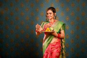 Young Housewife In Saree Celebrating The Karva Chauth Festival photo