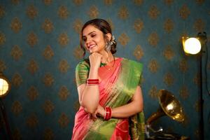 Stunning Lady Smiling In Saree During Diwali Festival Posing In Front Of The Camera photo