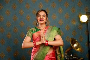 A Picture Of A Innocent Model In Traditional Indian Clothing During The Diwali Celebration Making The Namaste Gesture photo