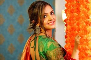 Picture Of A Lady In Saree During Diwali Festival Posing In Front Of The Camera photo