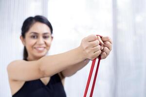 Fitness Instructor Posing With Resistance Bands photo