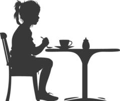 silueta pequeño niña sentado a un mesa en el café negro color solamente vector