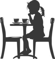 silueta pequeño niña sentado a un mesa en el café negro color solamente vector