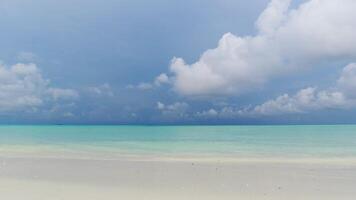 Beach blue sky seascape ocean horizon island. Scene cloudscape wave sea splashing sandy sunny. Landscape summer beach sea space area. surface video