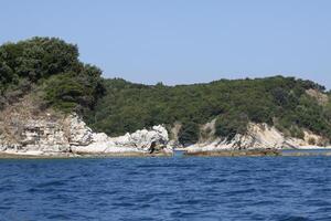 rented boat trip on the sea, sailing along the coast photo