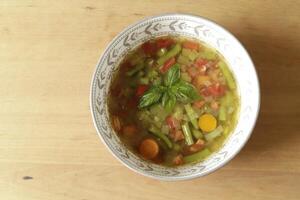tomato, green bean, soup with basil photo