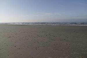 low tide at the beach of sint maartenszee, the netherlands photo