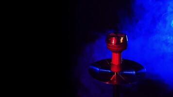 shisha bowl of the hookah with hot coals against a dark background video