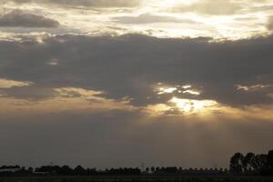 sunset in the netherlands, clouds, colors photo