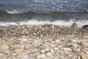 waves crash on the shore photo