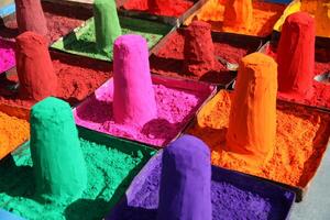 colorful powders to make mandalas on the streets, use for tikka, holi, and many other hindi events photo