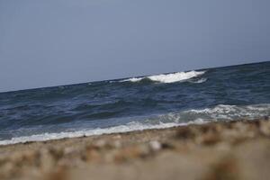 rough sea with many waves, no straight horizon, it feels like you are swaying on the waves photo