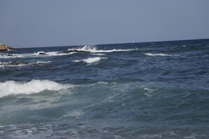 rough sea with many waves, no straight horizon, it feels like you are swaying on the waves photo