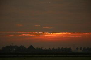 sunset in the netherlands, clouds, colors photo