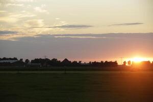 sunset in the netherlands, clouds, colors photo