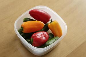 mini bell peppers, red, green, yellow photo