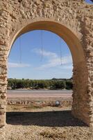 roman aqueduct in antas, spain photo