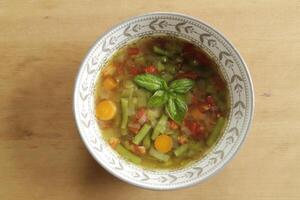 tomato, green bean, soup with basil photo