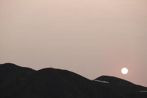 sunset in the mountains, sahara sand in the sky, spain photo