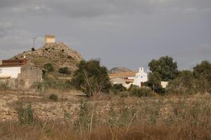 along the almanzora river, the village and on top of the mountain the santa barbara church photo