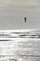 beach in the winter, kitesurfing, in the netherlands photo