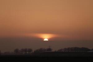 sunset in the netherlands, clouds, colors photo