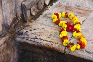 yellow red flower offer to a hindi god photo