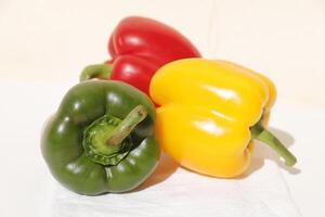 three colors bell pepper, red, green, yellow photo